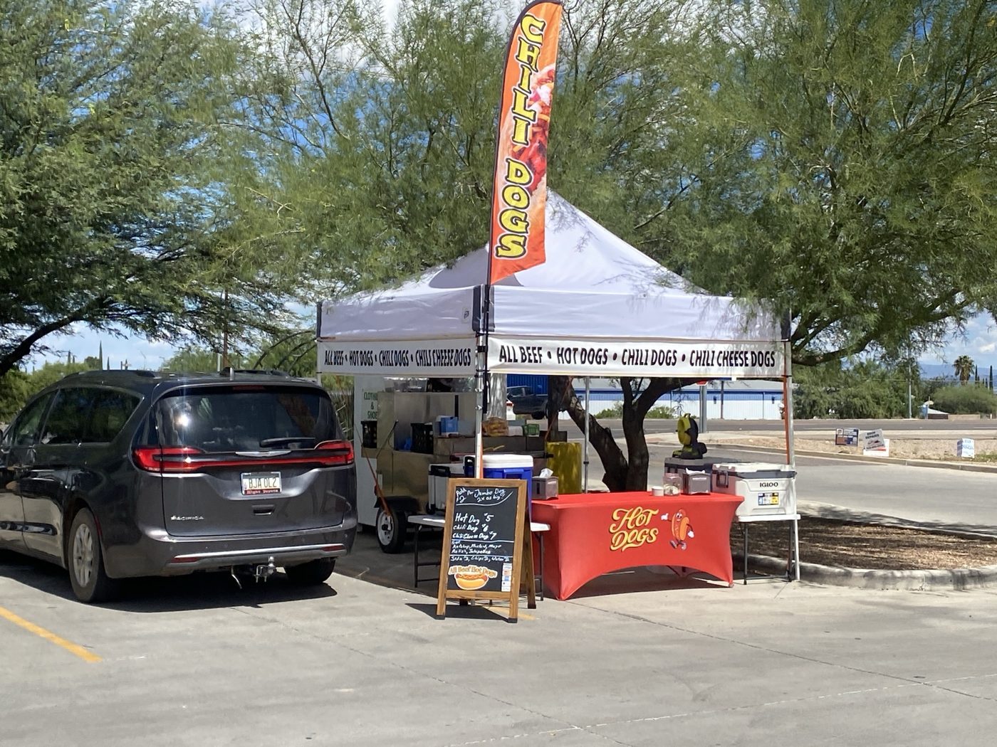 Desert Grub Co. hot dog booth at an outdoor location